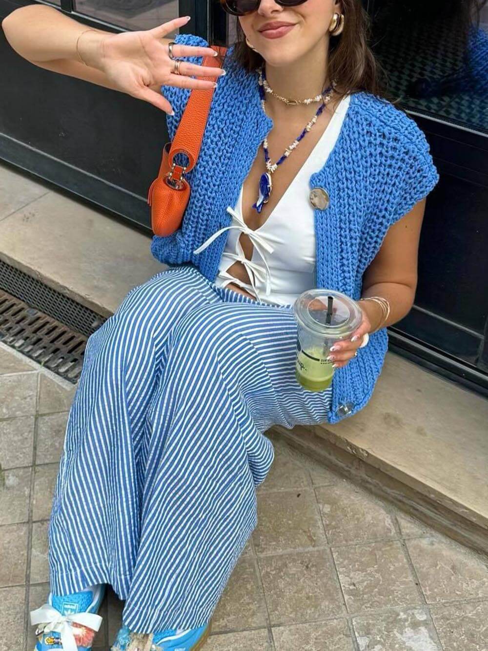 Élégant cardigan court sans manches à poche